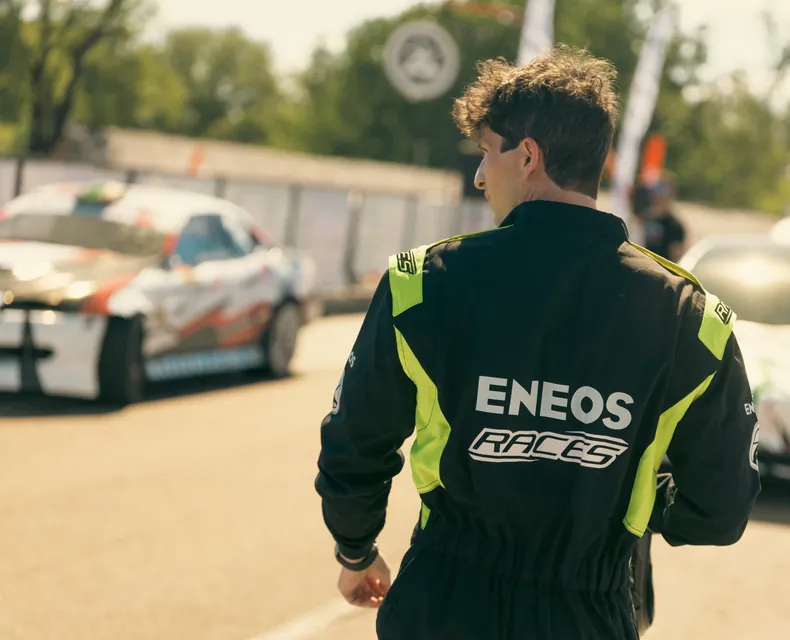 Olivér Ámon from behind in the pit lane, the main sponsor ENEOS logo on his race suit